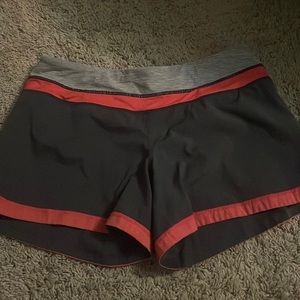 Iululemon, size 6 shorts. Pink and dark grey.